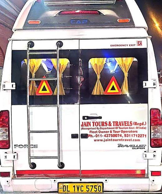 Tempo Traveller — rear view with roof carrier