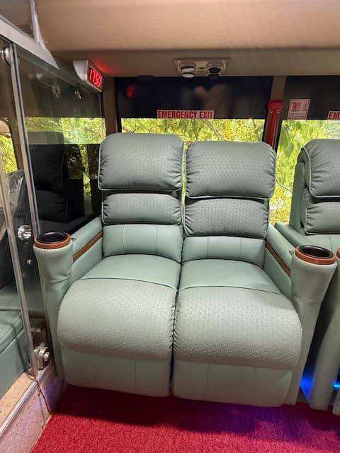 Reclining lounge seats with side tables